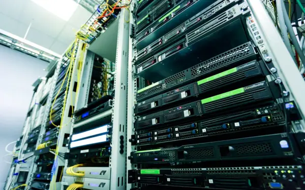 High-tech server rack in a secure data center with network cables and hardware components.